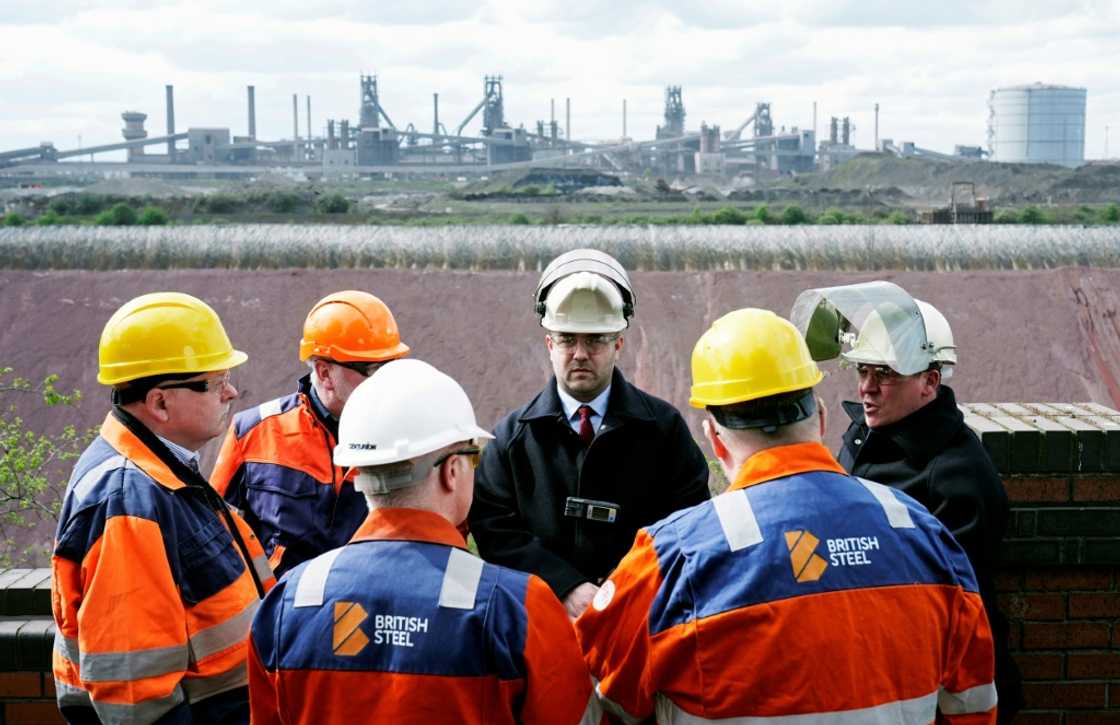 British Steel staff members gather at the plant as they take over its running from the Chinese owners Jingye British Steel staff members gather at the plant as they take over its running from the Chinese owners Jingye