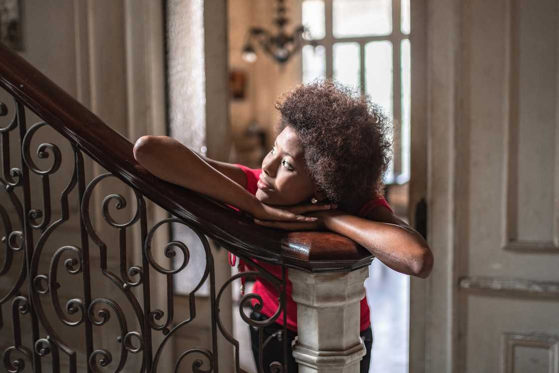 A lady admires her beautiful mansion A lady admires her beautiful mansion