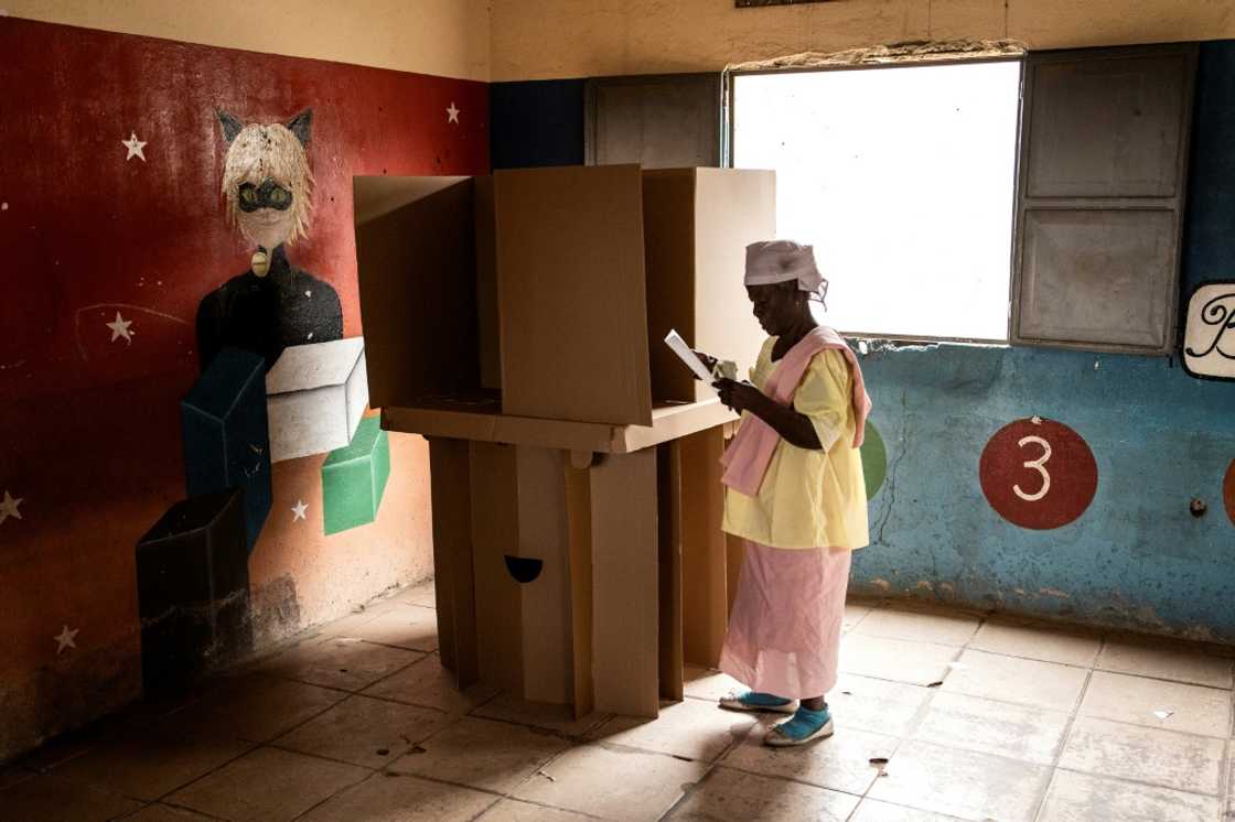 Angolans started casting ballots on August 24, 2022 in what is expected to be the most competitive vote in its democratic history, with incumbent president Joao Lourenco squaring up against charismatic opposition leader Adalberto Costa Junior. A woman folds her ballot paper at a voting booth in Luanda on August 24, 2022, during Angola's general elections. Angolans started casting ballots on August 24, 2022 in what is expected to be the most competitive vote in its democratic history, with incumbent president Joao Lourenco squaring up against charismatic opposition leader Adalberto Costa Junior. A woman folds her ballot paper at a voting booth in Luanda on August 24, 2022, during Angola's general elections.
