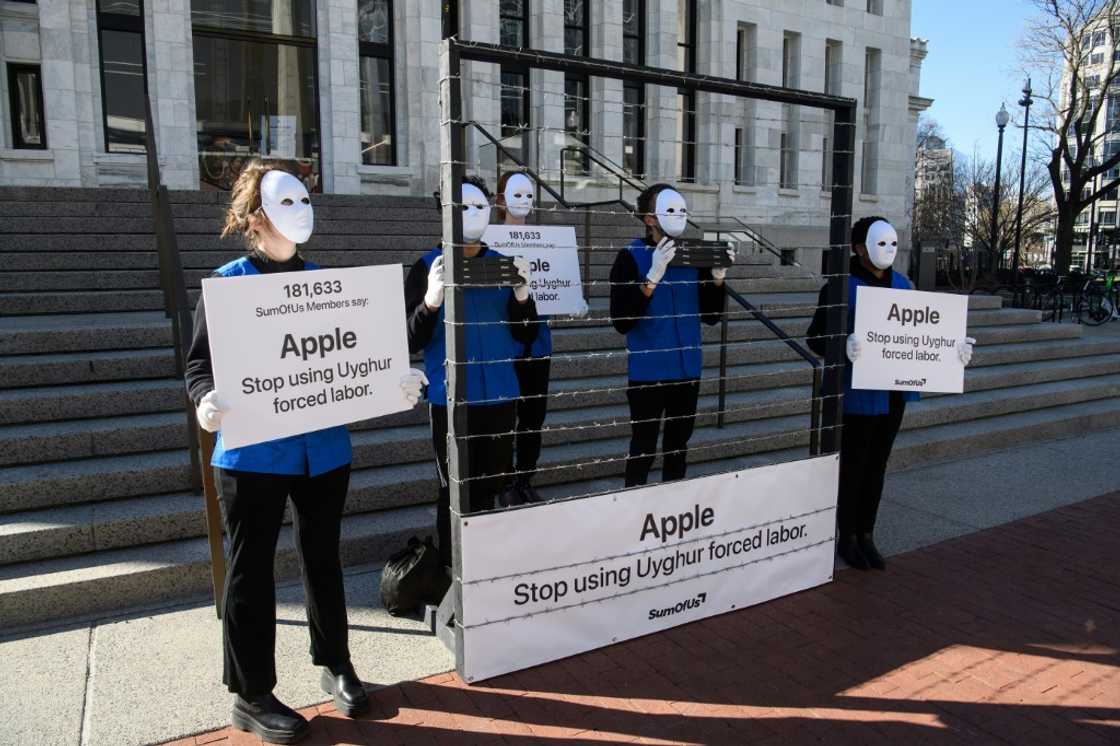 Demonstrators set up a mock Uyghur forced labor camp outside the Apple flagship store in Washington DC in March 2022, to call for the company not to use Uyghur forced labor Demonstrators set up a mock Uyghur forced labor camp outside the Apple flagship store in Washington DC in March 2022, to call for the company not to use Uyghur forced labor