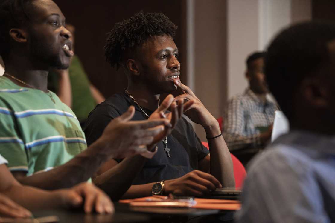 Students in a lecture hall Students in a lecture hall