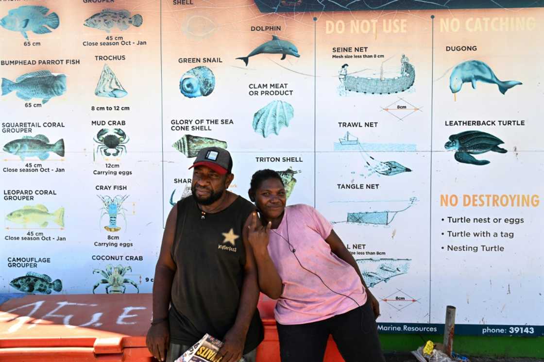 A faded sign at Honiara's seaside market warns against the live wildlife trade, singling out dolphins as a 'no sell' species