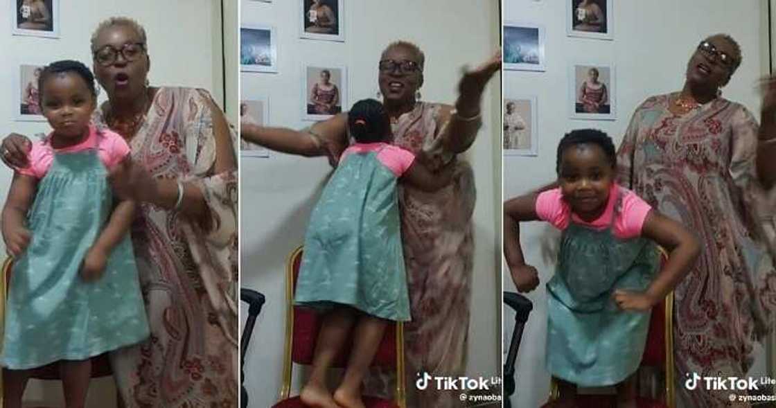 Nigerian mum dances with her adopted child