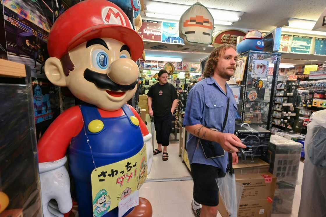 Around 70-80 percent of his customers are foreign tourists, who have flocked to Japan in record numbers this year, says the manager of a vintage video game shop Around 70-80 percent of his customers are foreign tourists, who have flocked to Japan in record numbers this year, says the manager of a vintage video game shop