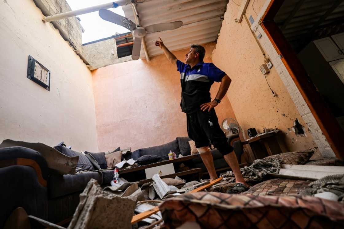 A man inspects damage to a house affected by an Israeli air strike at the Jabalia camp for Palestinian refugees in the northern Gaza Strip on August 6, 2022 A man inspects damage to a house affected by an Israeli air strike at the Jabalia camp for Palestinian refugees in the northern Gaza Strip on August 6, 2022