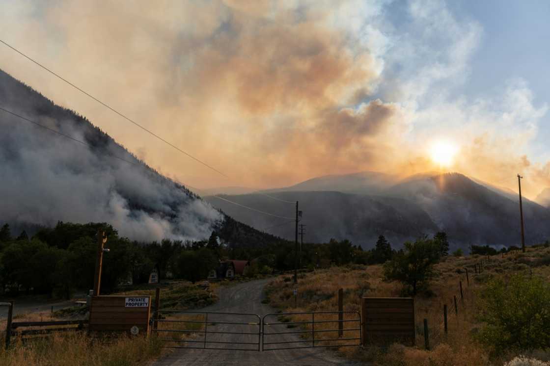Smoke pours from the Crater Creek Fire, one of hundreds of active wildfires in westernmost British Columbia province Smoke pours from the Crater Creek Fire, one of hundreds of active wildfires in westernmost British Columbia province