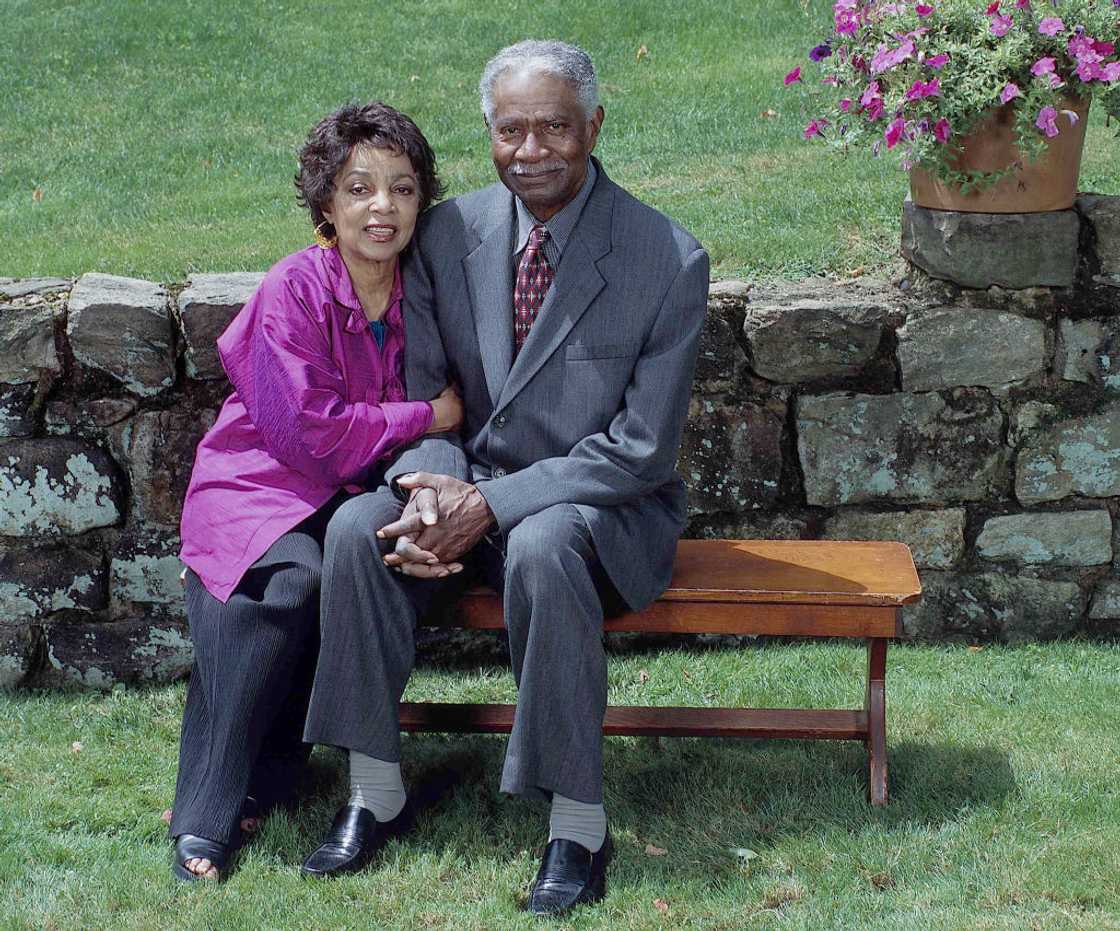 Ossie Davis (R) taking a picture with Rene Dee (L)