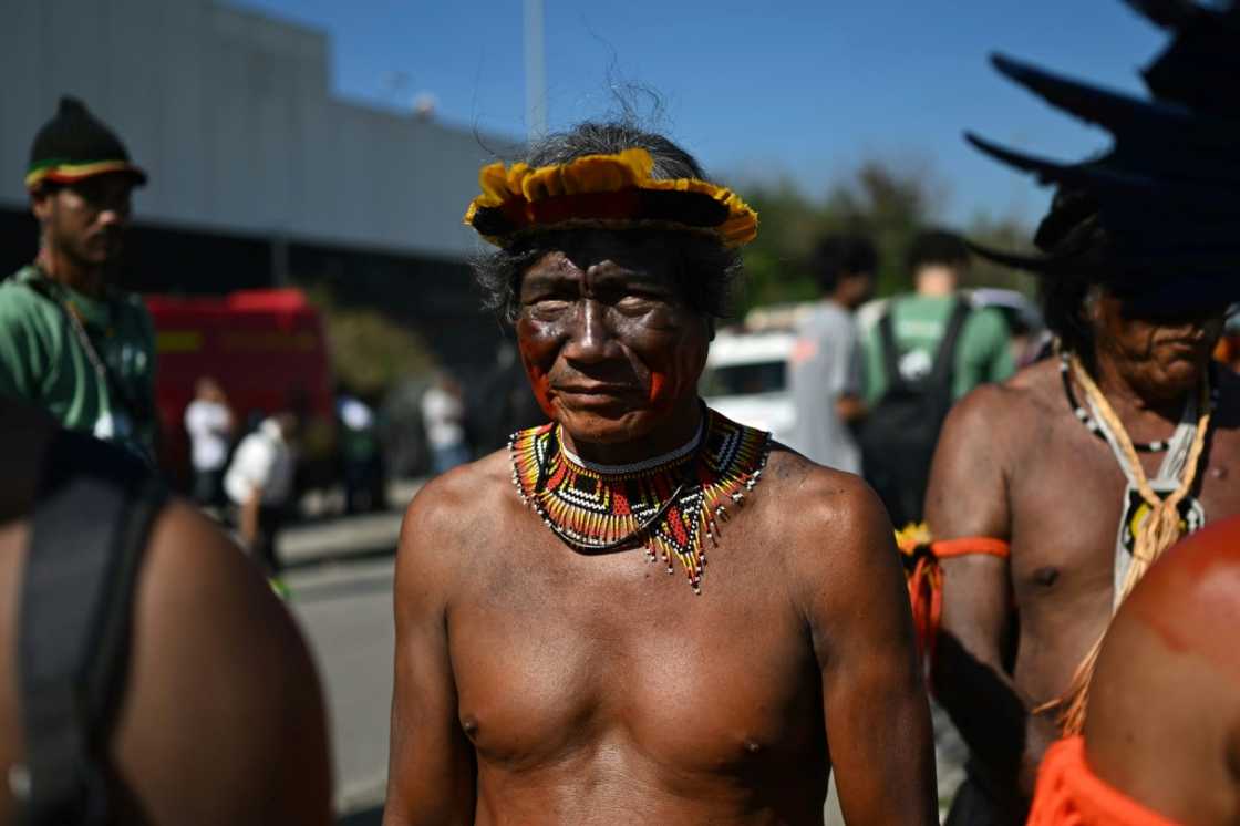 Indigenous people take part in a demonstration in front of the hotel in Rio de Janeiro where an oil blocks auction is taking place Indigenous people take part in a demonstration in front of the hotel in Rio de Janeiro where an oil blocks auction is taking place