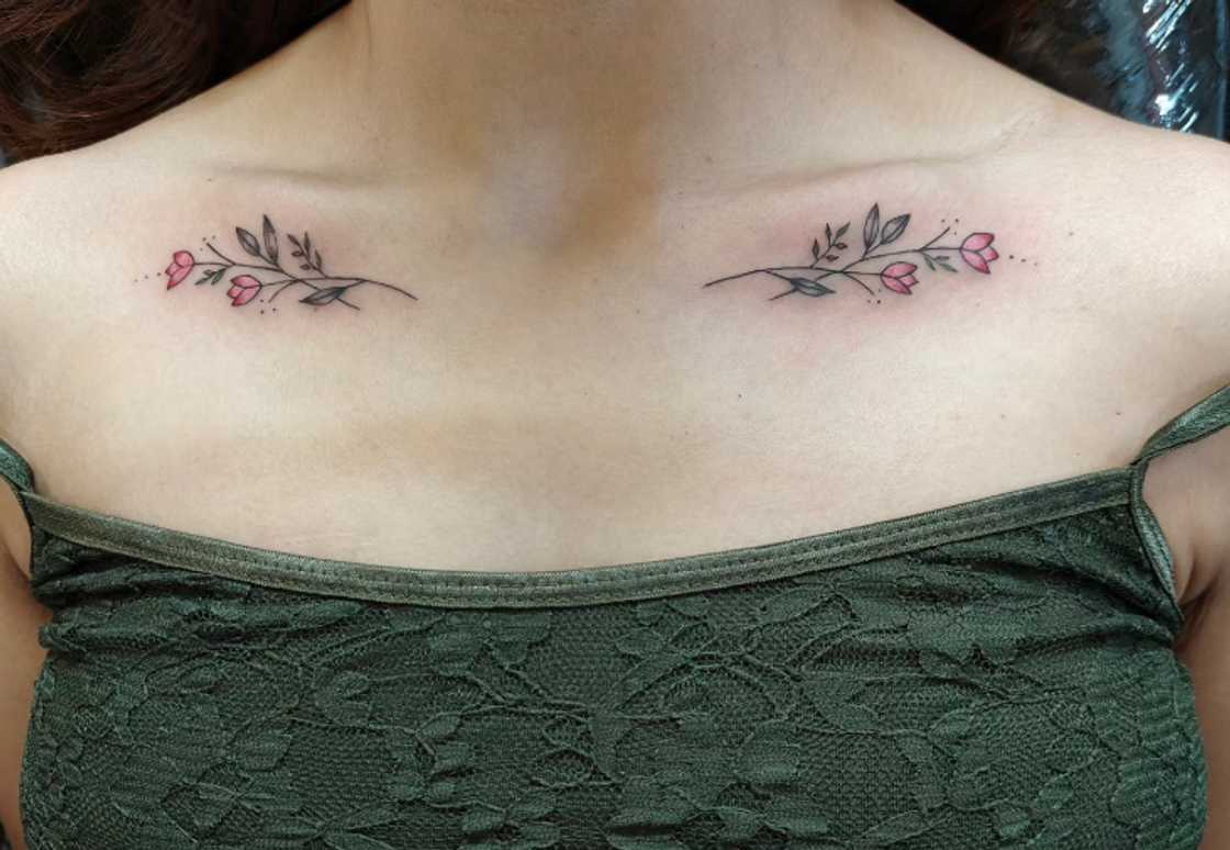 Detailed tiny rose collarbone tattoo