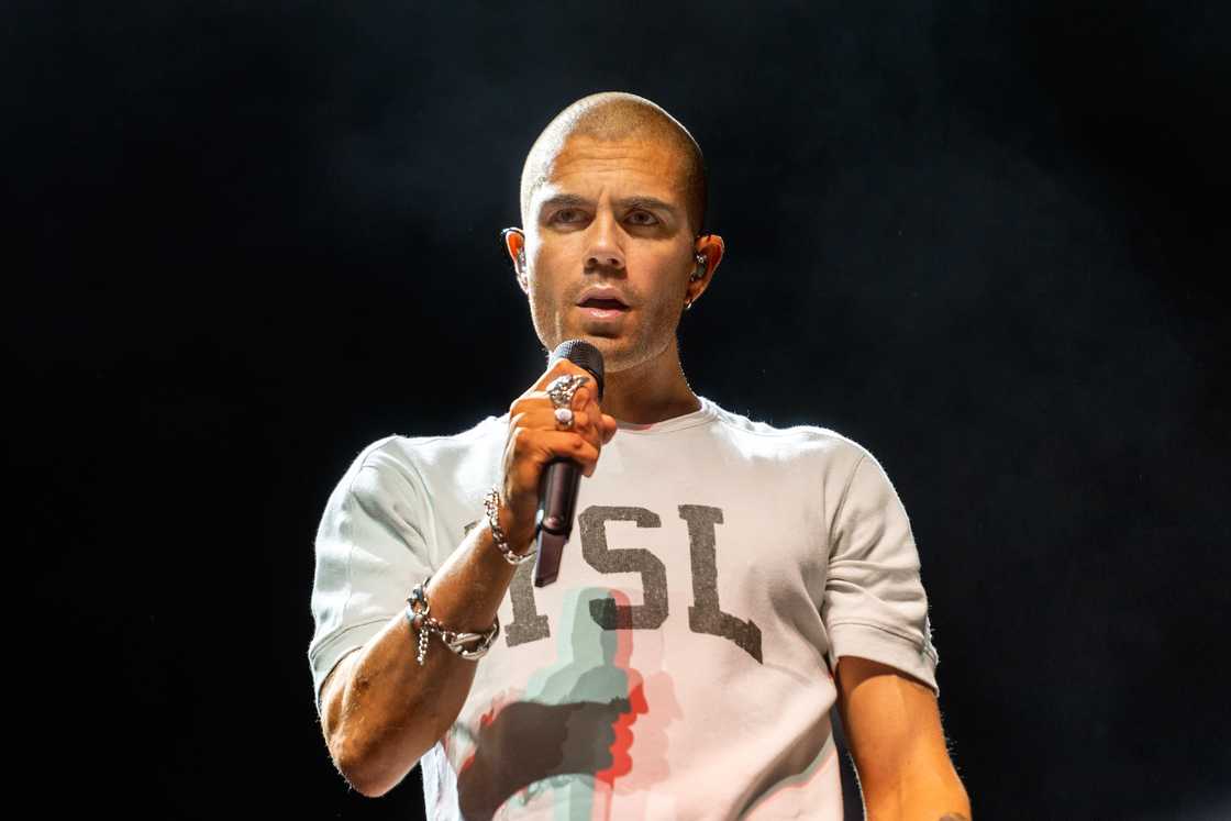 Max George of The Wanted performs on stage. Max George of The Wanted performs on stage.