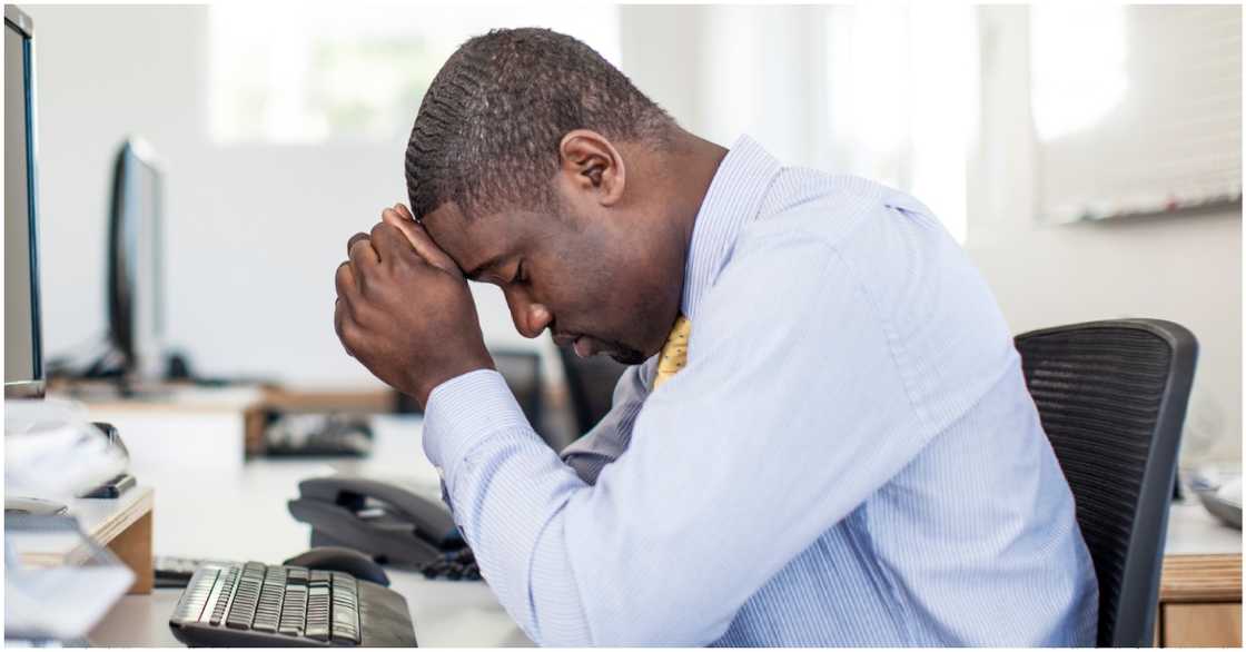 Photo of man looking sad in an office