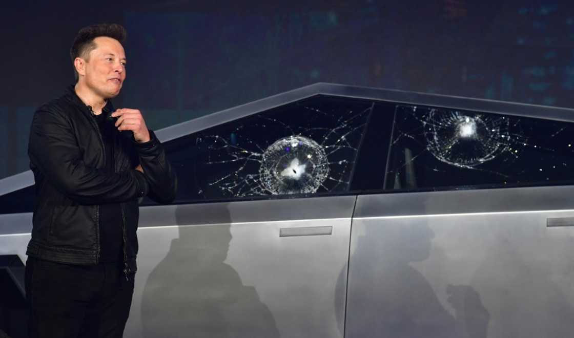Tesla co-founder and CEO Elon Musk verbally reacts in front of the newly unveiled all-electric battery-powered Tesla Cybertruck with broken glass on windows following a demonstation that did not go as planned on November 21, 2019 at Tesla Design Center in Hawthorne, California Tesla co-founder and CEO Elon Musk verbally reacts in front of the newly unveiled all-electric battery-powered Tesla Cybertruck with broken glass on windows following a demonstation that did not go as planned on November 21, 2019 at Tesla Design Center in Hawthorne, California