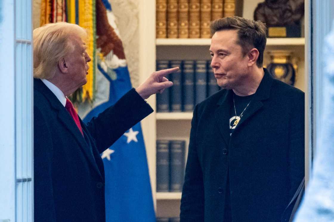 (FILES) US President Donald Trump and Elon Musk (R) speak in the Oval Office before departing the White House in Washington, DC, on the way to Trump's residence at Mar-a-Lago in Palm Beach, Florida on March 14, 2025. (FILES) US President Donald Trump and Elon Musk (R) speak in the Oval Office before departing the White House in Washington, DC, on the way to Trump's residence at Mar-a-Lago in Palm Beach, Florida on March 14, 2025.