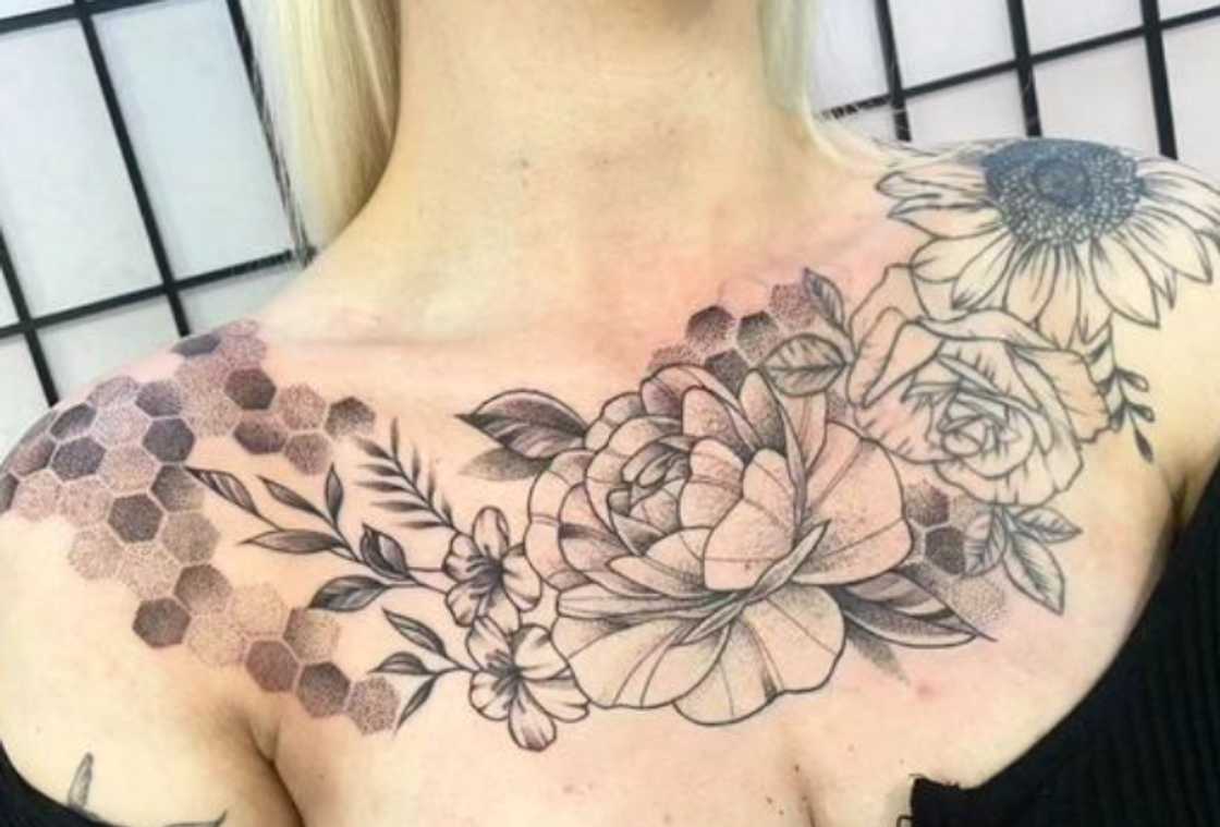 Roses and scattered petals collarbone tattoo