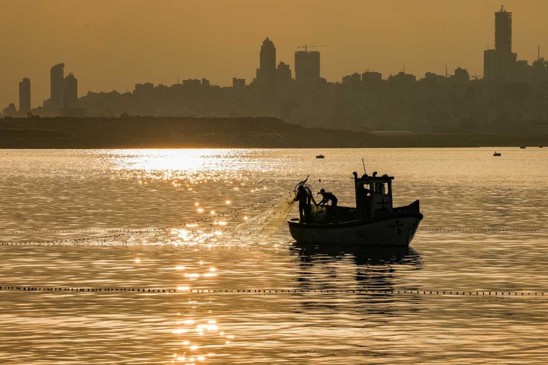 A fisherman pulls his net from the Mediterranean Sea on a trawler off Dbayeh near Lebanon's capital Beirut A fisherman pulls his net from the Mediterranean Sea on a trawler off Dbayeh near Lebanon's capital Beirut