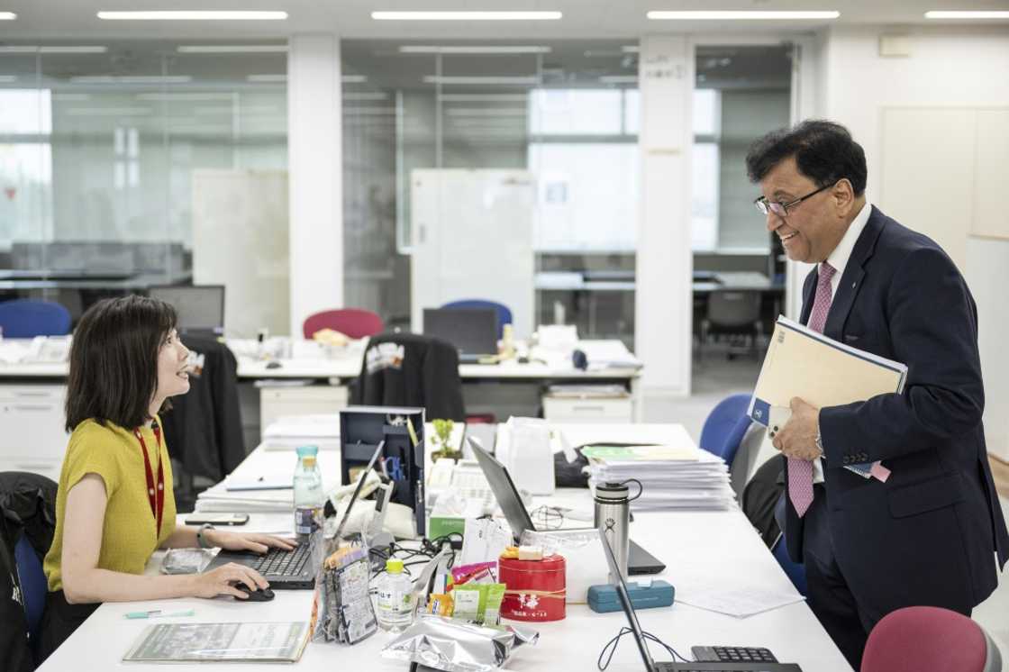 Lekh Juneja chatting with an employee at the company's headquarters in Niigata city, Niigata prefecture Lekh Juneja chatting with an employee at the company's headquarters in Niigata city, Niigata prefecture