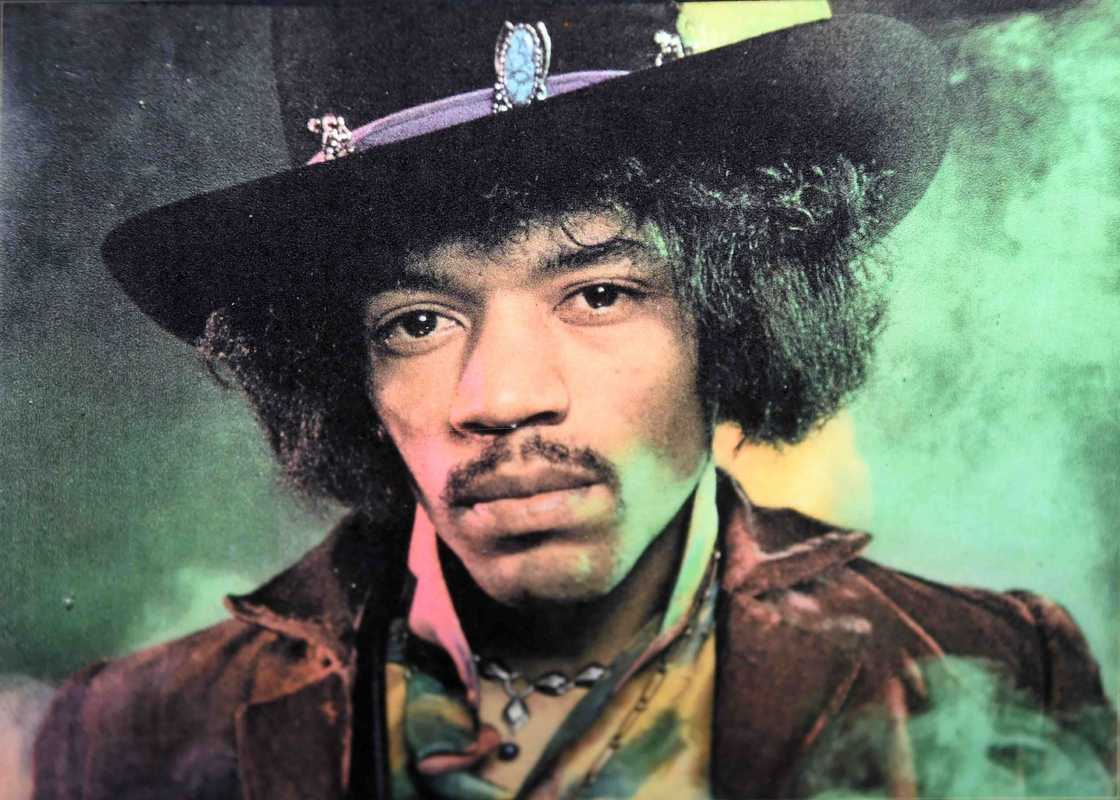 Jimi Hendrix in a black hat