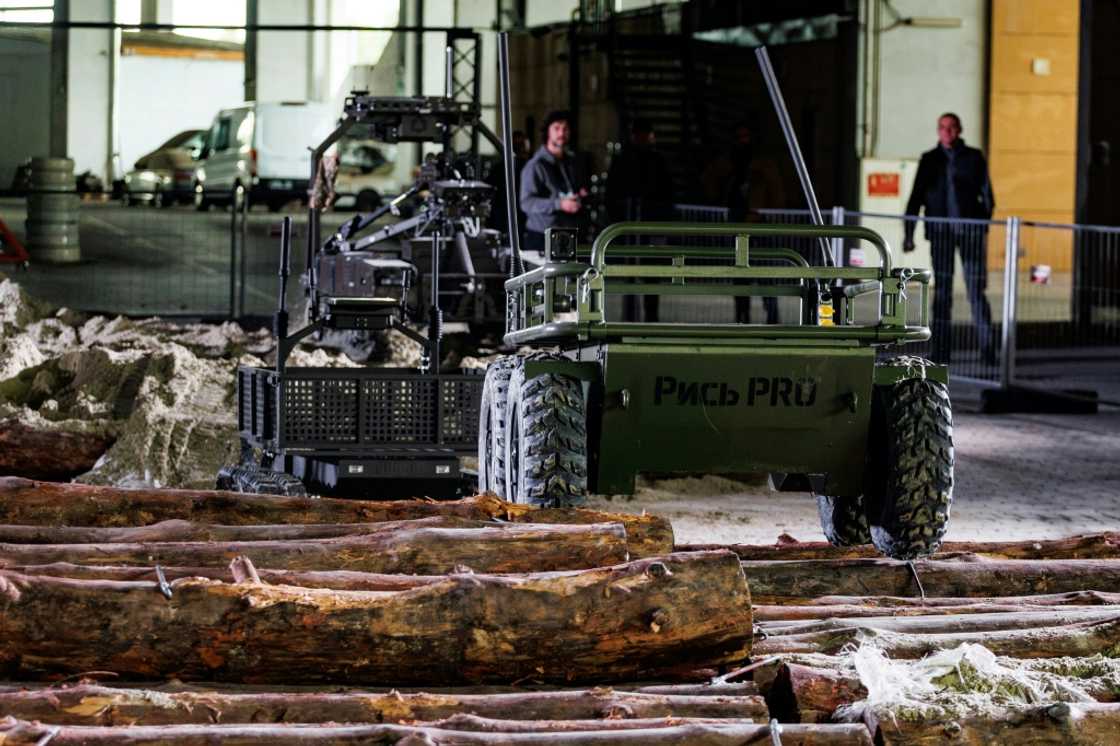 Robots resembling oversized remote-controlled cars help ferry weapons to the front or evacuate wounded soldiers