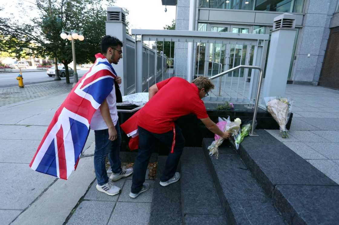 Mourners in Ottawa, Canada place flowers on the front steps of the British High Commission after the death of Queen Elizabeth II Mourners in Ottawa, Canada place flowers on the front steps of the British High Commission after the death of Queen Elizabeth II