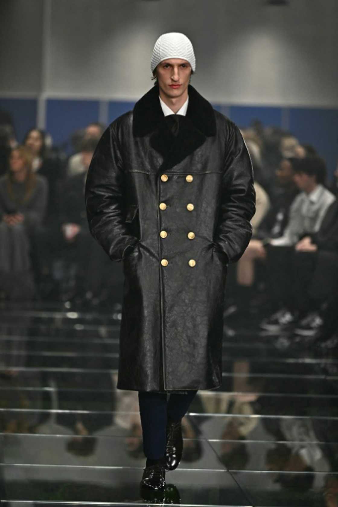 Big gold buttons on large parkas were a feature of the Prada collection Big gold buttons on large parkas were a feature of the Prada collection