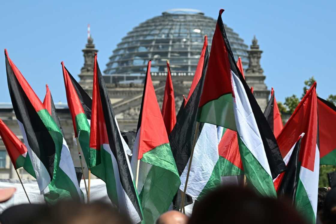 Protestors hold Palestinian flags at a 'United 4 Gaza!' rally in front of the Reichstag building in Berlin on June 21, 2025 Protestors hold Palestinian flags at a 'United 4 Gaza!' rally in front of the Reichstag building in Berlin on June 21, 2025