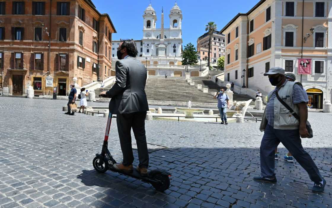 A rider passes the Spanish Steps in Rome, where a project is underway to clamp down on e-scooter use in the city A rider passes the Spanish Steps in Rome, where a project is underway to clamp down on e-scooter use in the city