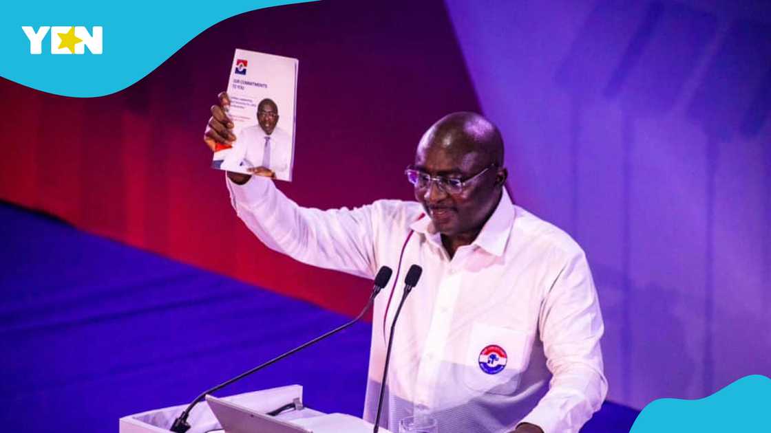 Mahamdu Bawumia holds up the 2024 NPP manifesto at the launch event in Takoradi.