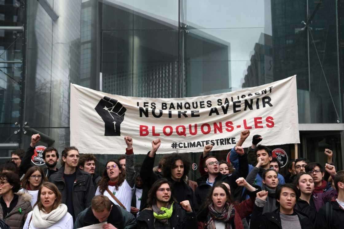 Climate activists held a banner reading 'Banks dirty our future. Let's block them' outside the headquarters of French bank Societe Generale in 2019. Protests are one of the risks bank face over their response to climate change Climate activists held a banner reading 'Banks dirty our future. Let's block them' outside the headquarters of French bank Societe Generale in 2019. Protests are one of the risks bank face over their response to climate change