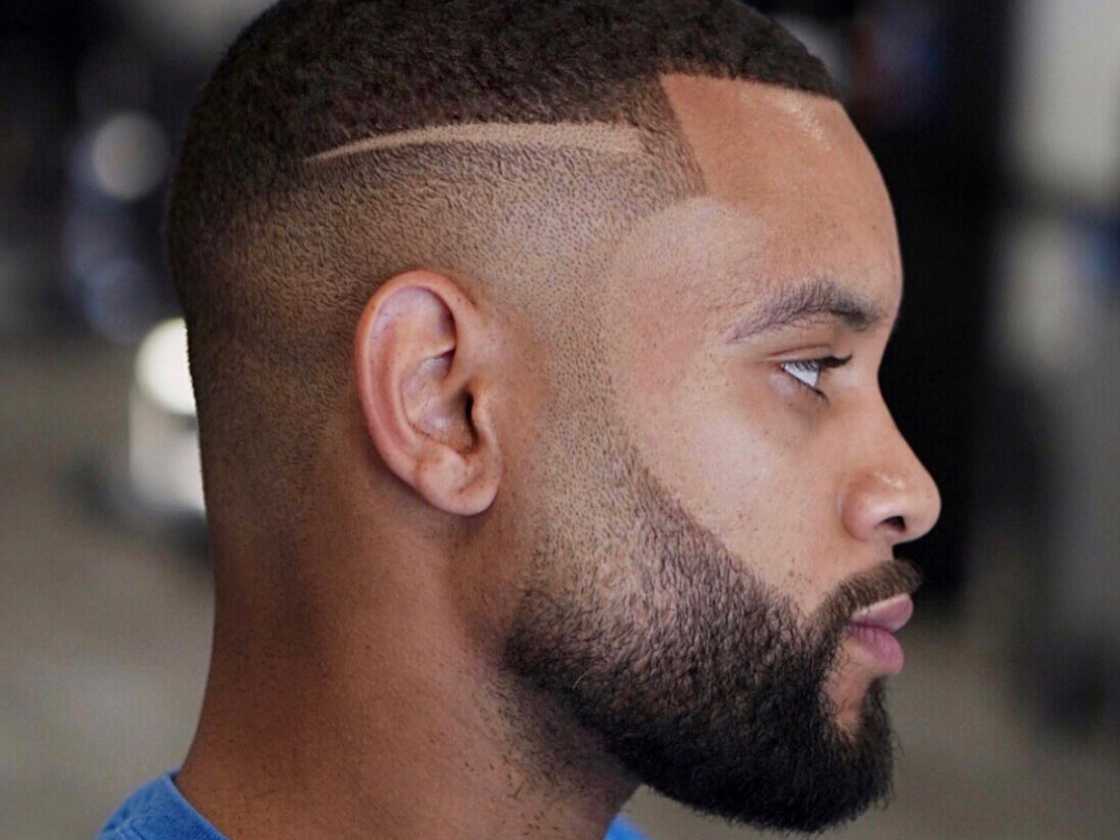 A man with short faded beards and low fade haircut A man with short faded beards and low fade haircut