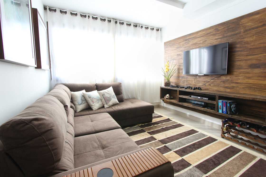 A smart TV in a brown-themed living room A smart TV in a brown-themed living room