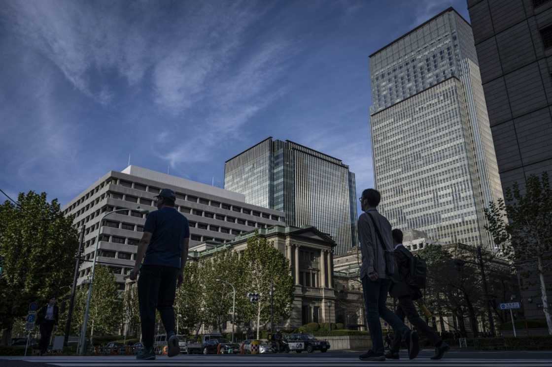 The Bank of Japan kept its main interest rate unchanged on Thursday, warning of 'high uncertainties surrounding Japan's economic activity and prices' The Bank of Japan kept its main interest rate unchanged on Thursday, warning of 'high uncertainties surrounding Japan's economic activity and prices'