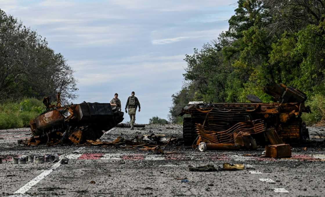 Destroyed armored vehicles litter the road in Balakliya, in the Kharkiv region Destroyed armored vehicles litter the road in Balakliya, in the Kharkiv region