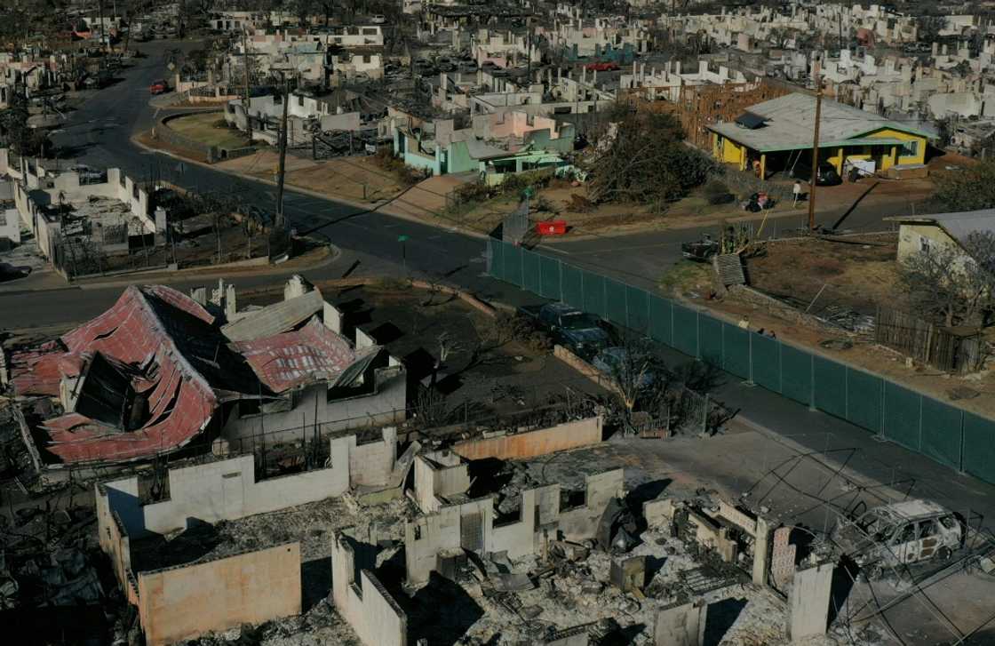 An aerial image shows destroyed homes and vehicles in the aftermath of the Maui wildfires in Lahaina, Hawaii on August 17, 2023 An aerial image shows destroyed homes and vehicles in the aftermath of the Maui wildfires in Lahaina, Hawaii on August 17, 2023