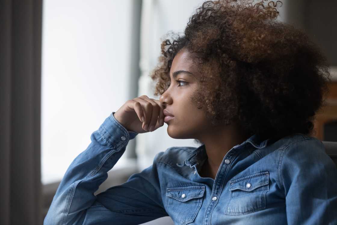 Close-up face of an African, sad, thoughtful teenage girl Close-up face of an African, sad, thoughtful teenage girl