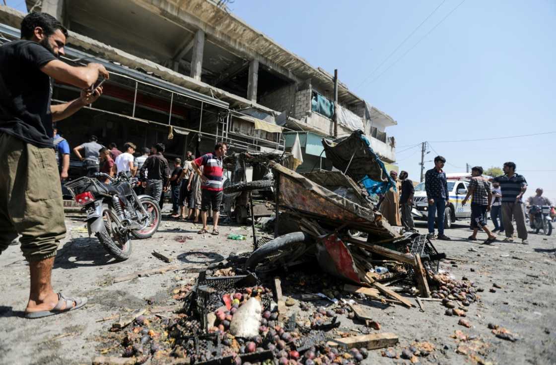 Syrian regime artillery fire on the town of Al-Bab, under the authority of Turkish-controlled Syrian forces, killed 15 civilians, a war monitor said -- people inspected damage at a market Syrian regime artillery fire on the town of Al-Bab, under the authority of Turkish-controlled Syrian forces, killed 15 civilians, a war monitor said -- people inspected damage at a market