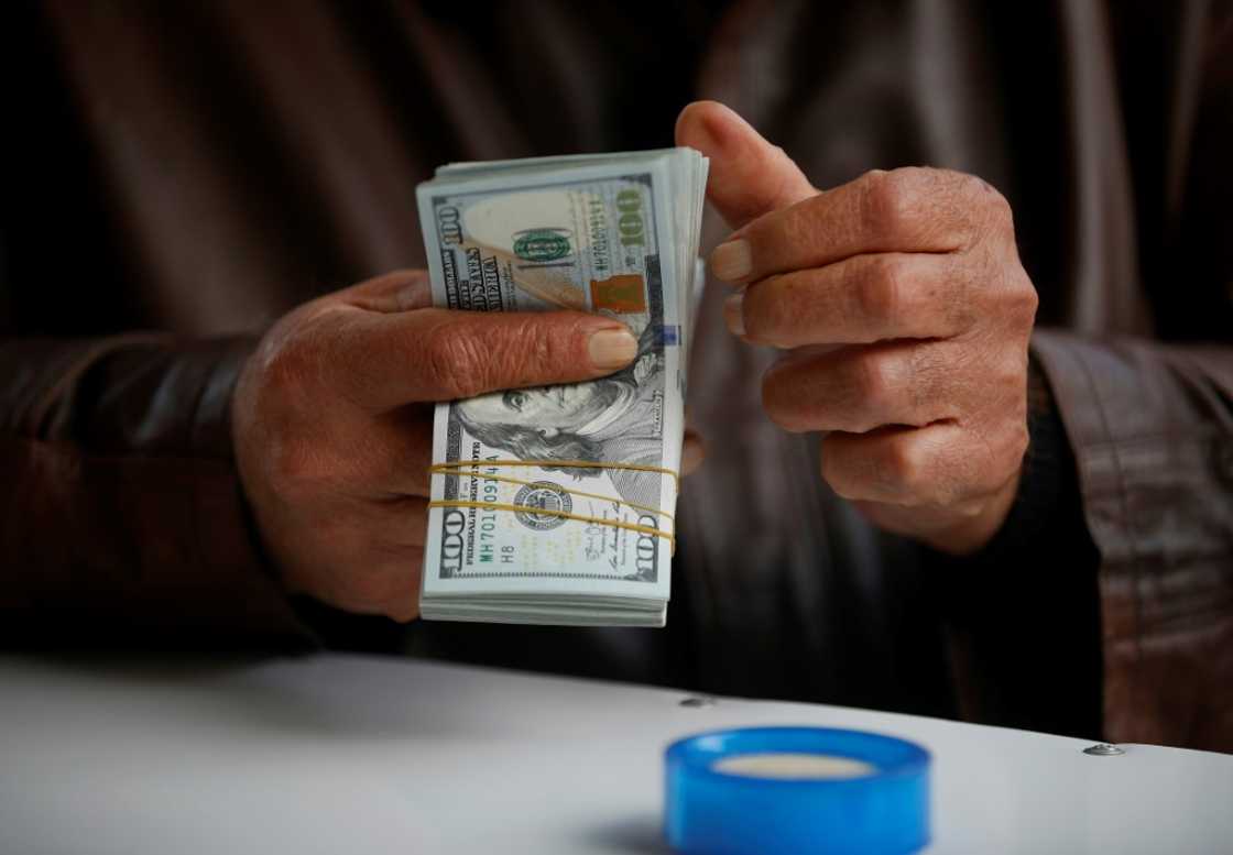 Some Iraqi officials have placed the blame for the dinar's woes squarely on the shoulders of one actor -- the United States Some Iraqi officials have placed the blame for the dinar's woes squarely on the shoulders of one actor -- the United States