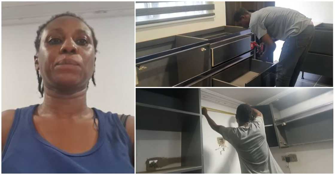A woman proudly flaunts the house she has been building in Ghana for eight years