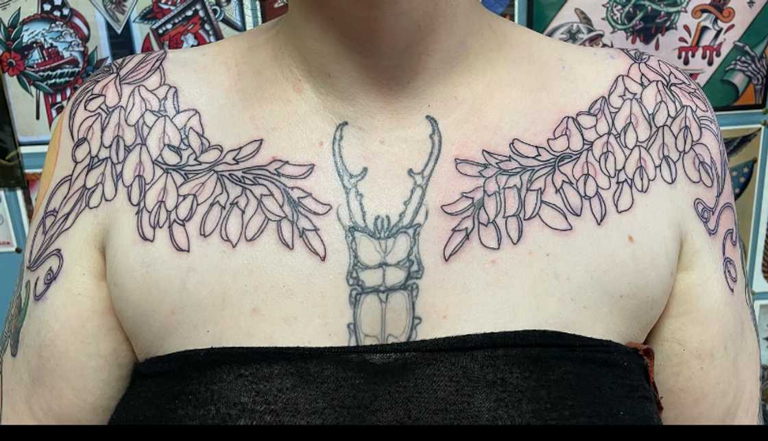 Symmetrical vine tattoo