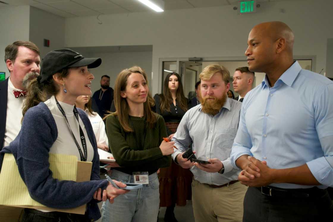 Gellman asks Maryland Governor Wes Moore a question after a press conference at an urban Maryland