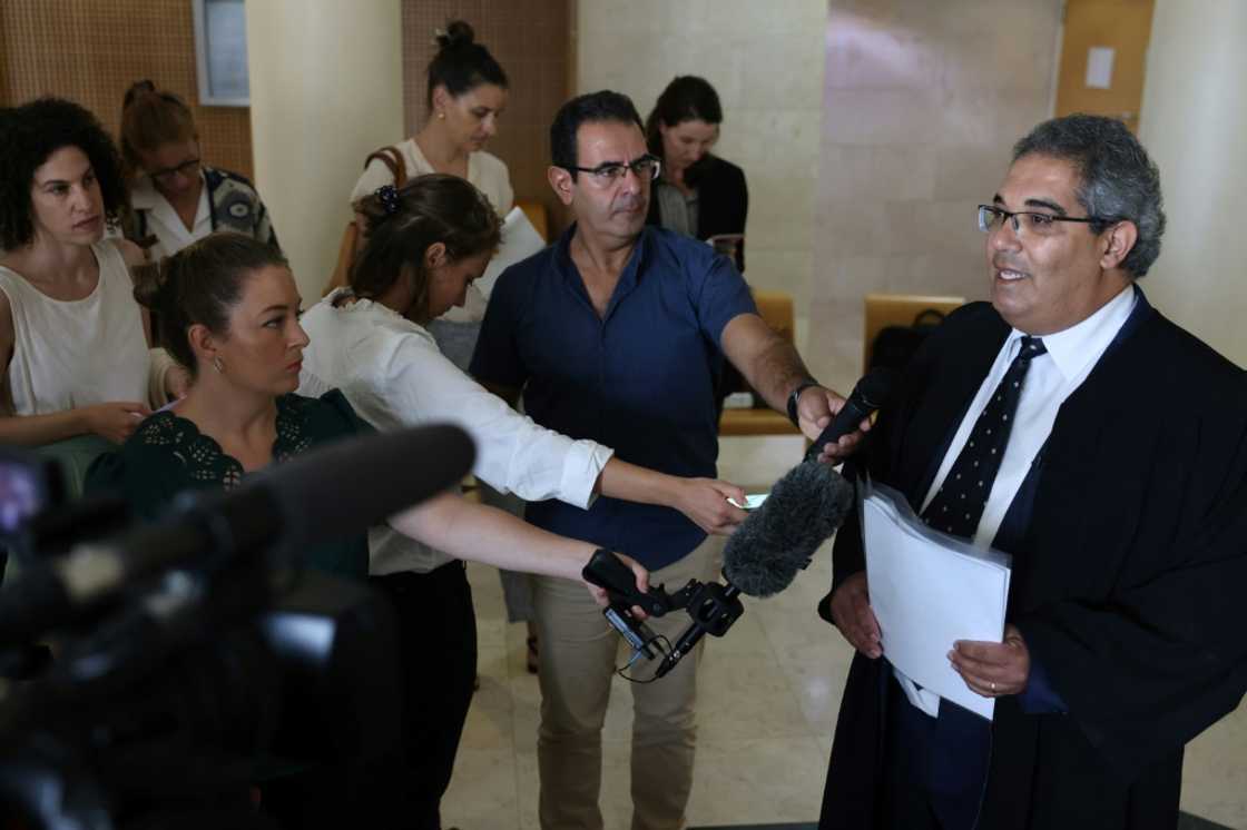 Palestinian lawyer Maher Hanna, the lawyer Mohammed al-Halabi, speaks to reporters after his client was sentenced to 12 years in prison Palestinian lawyer Maher Hanna, the lawyer Mohammed al-Halabi, speaks to reporters after his client was sentenced to 12 years in prison