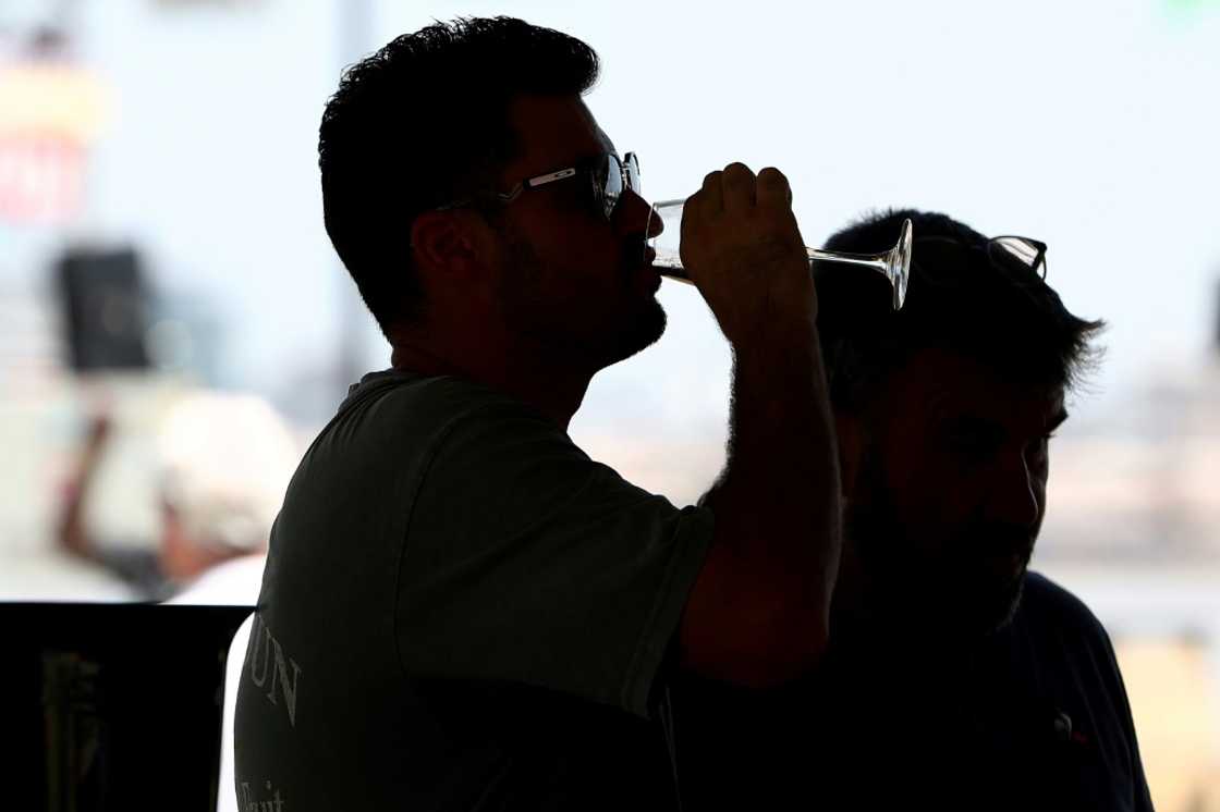 A visitor enjoys the Bordeaux wine festival -- but US tariffs will hit hard a sector already under pressure A visitor enjoys the Bordeaux wine festival -- but US tariffs will hit hard a sector already under pressure