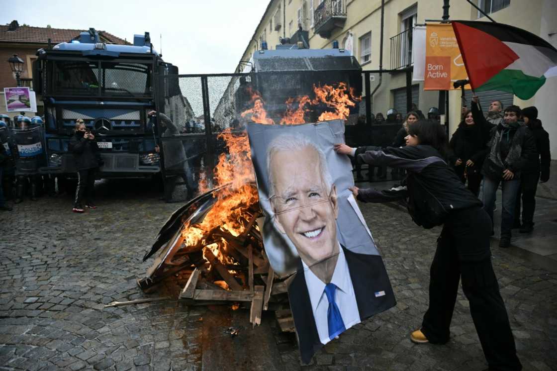 Activists burn a portrait of US President Joe Biden and G7 leaders during a demonstration against the G7 Climate, Energy and Environment held in Turin, on April 28 Activists burn a portrait of US President Joe Biden and G7 leaders during a demonstration against the G7 Climate, Energy and Environment held in Turin, on April 28