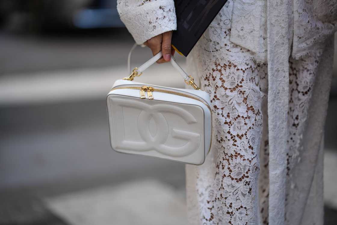 White Dolce & Gabbana bag with gold hardware and logo detail. White Dolce & Gabbana bag with gold hardware and logo detail.