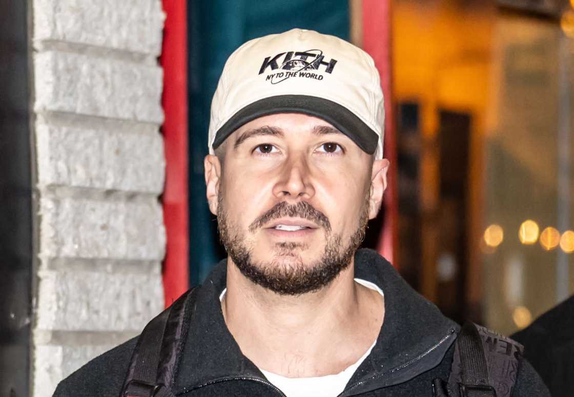 Vinny Guadagnino in a cap and black jacket