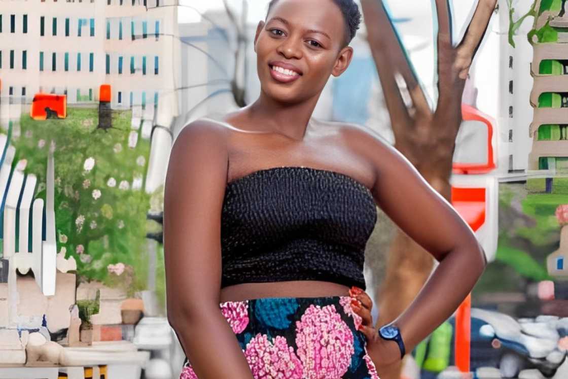 An African woman is wearing a colourful African skirt and a black tube top An African woman is wearing a colourful African skirt and a black tube top