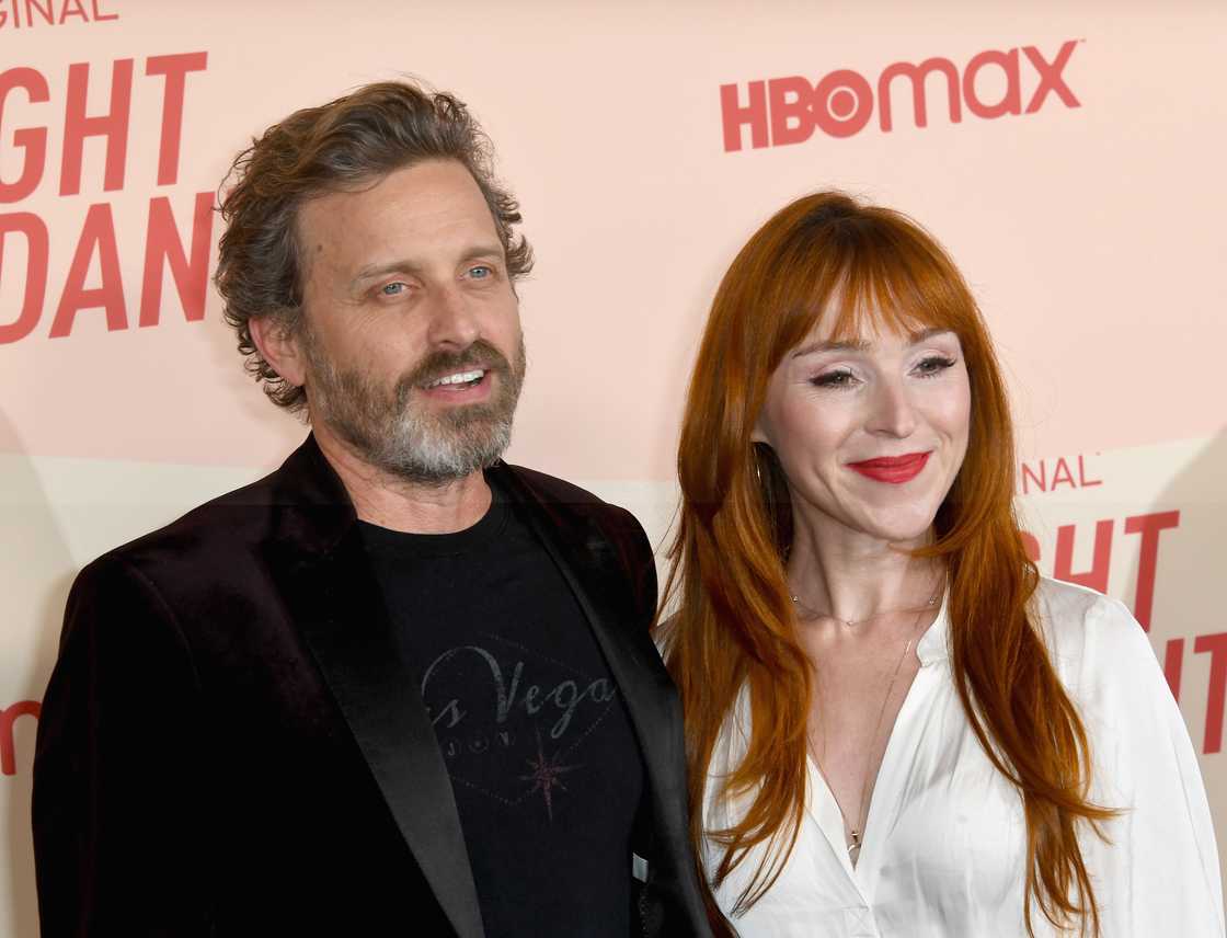 Rob Benedict and Ruth Connell pose at a TV series premiere in West Hollywood.