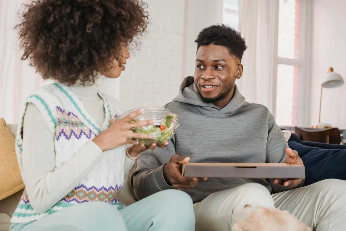 A young couple talking indoors