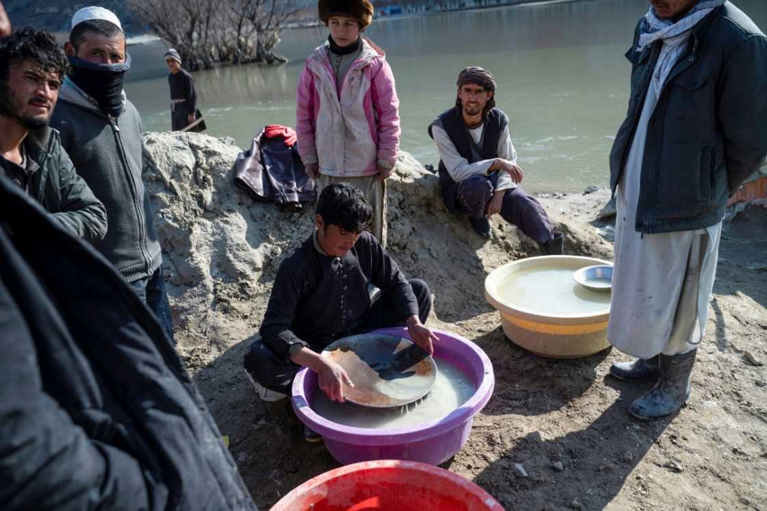 An Afghan youth (C) pans for gold in the traditional way at a gold mine along the Kokcha River An Afghan youth (C) pans for gold in the traditional way at a gold mine along the Kokcha River