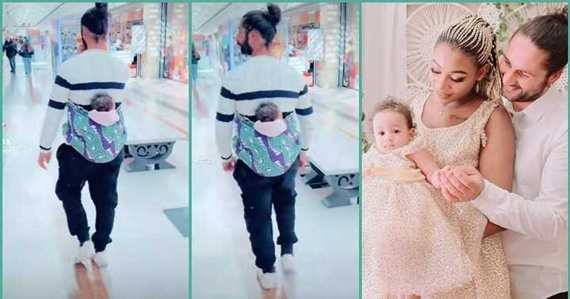 Obroni man melts hearts as he backs his baby with wrapper inside a mall Obroni man melts hearts as he backs his baby with wrapper inside a mall