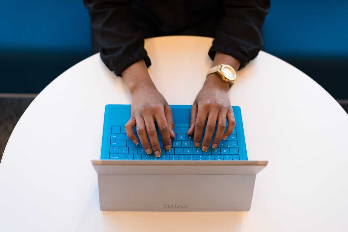 A person typing on a computer